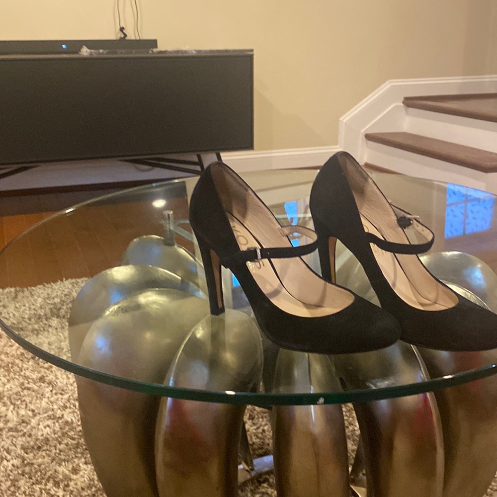Black size 7 high heeled Michael Kors suede pumps with front strap.